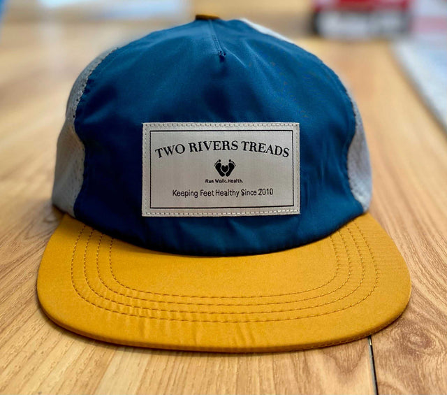 Territory Run Co. Custom Two Rivers Treads hat, a stylish accessory with unique design details and adjustable strap.