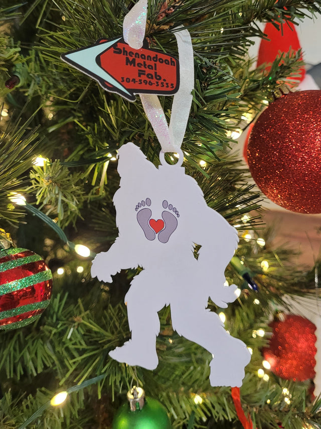 white yeti with gray feet and red heart