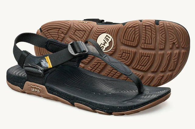 Lems Switchback Sandal shoes with adjustable straps and rugged soles, shown in a close-up side view.