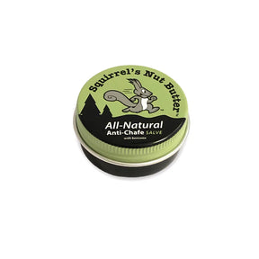 Squirrel Nut Butter all-natural anti-chafe balm in a 0.5 oz tin, with a printed label on the lid, designed for skin comfort.