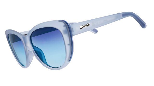 GOODR Spin Me In A Sapphire sunglasses shown from the side with transparent lenses and vibrant blue frames.