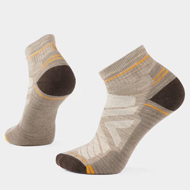 Smartwool Light Cushion Hike Ankle sock displayed on foot, showcasing breathable fabric and cushioned sole for hiking comfort.