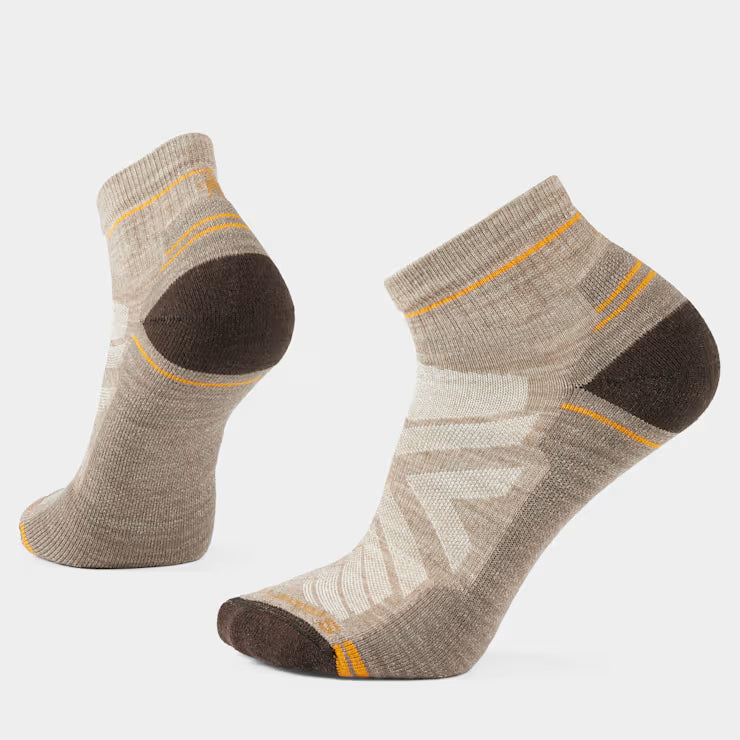 Smartwool Light Cushion Hike Ankle sock displayed on foot, showcasing breathable fabric and cushioned sole for hiking comfort.