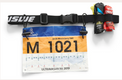 USWE Race ID Belt shown in a screenshot, featuring adjustable straps and multiple storage pouches for outdoor racing and cycling.