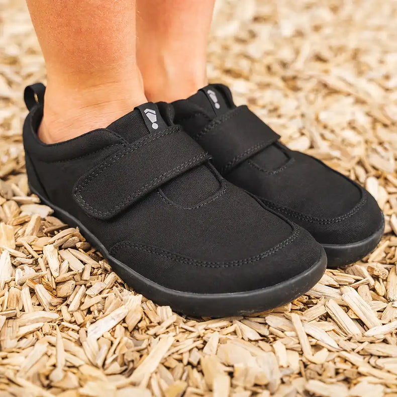 Black Explore 2.0 shoes by Splay showing sleek design and durable construction on a white background.