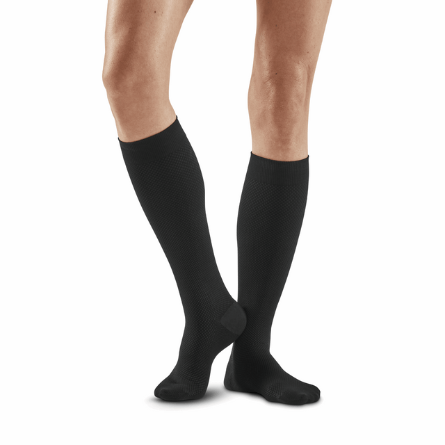 Black CEP Allday Tall Compression Socks for women, shown in a close-up image of the knee-high length and snug fit.