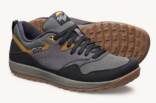 Lems Trail Blazer unisex shoes with gray and black design, showing side view and laced upper for outdoor walking comfort.