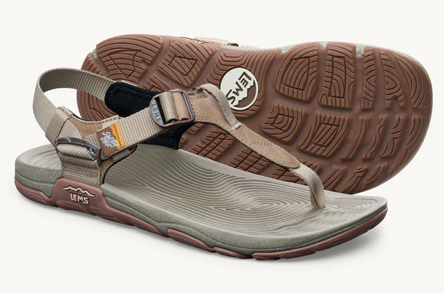 Lems Switchback Sandal shoes with tan straps and rugged soles, displayed as a 3/4 pair on a neutral background.