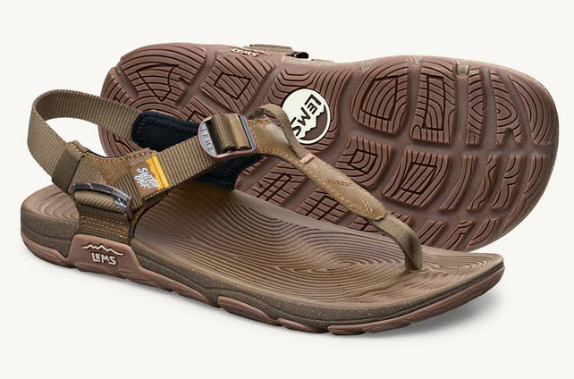 Lems Switchback Sandal shoes with adjustable straps and cushioned sole, shown in a sandstorm color, featuring a 3/4 view.
